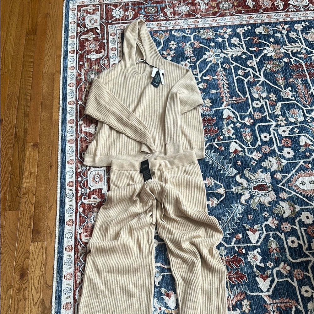 Cream full-length jumpsuit with long sleeves and collar